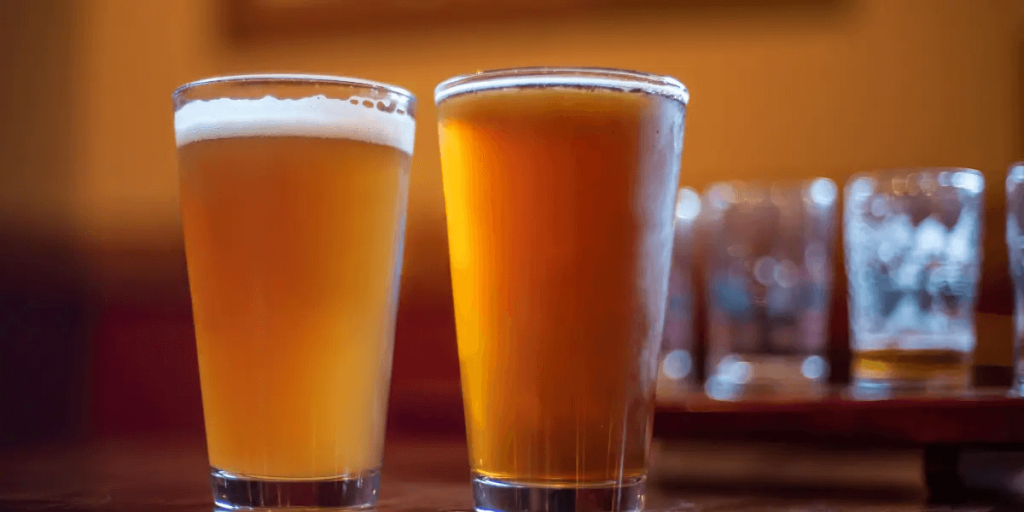 two glasses of hazy IPA on a table
