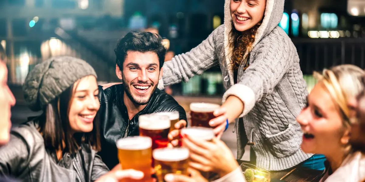 group of friends in a bar enjoying beer