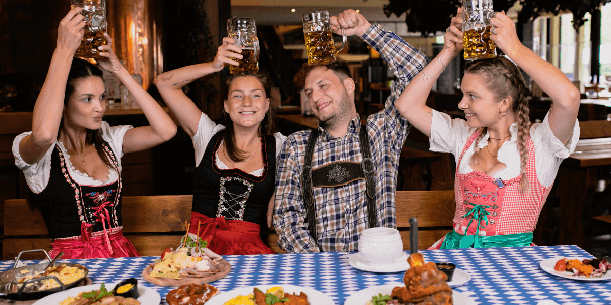 friends in costume enjoying Oktoberfest