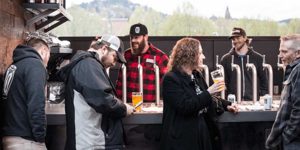 people enjoying beer at a bar