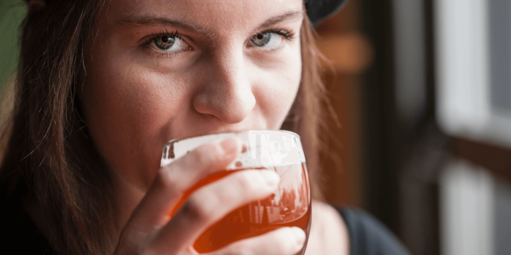 Young Woman Drinking an India Pale Ale