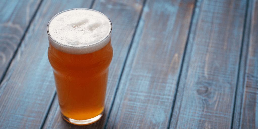 pale ale on blue wood