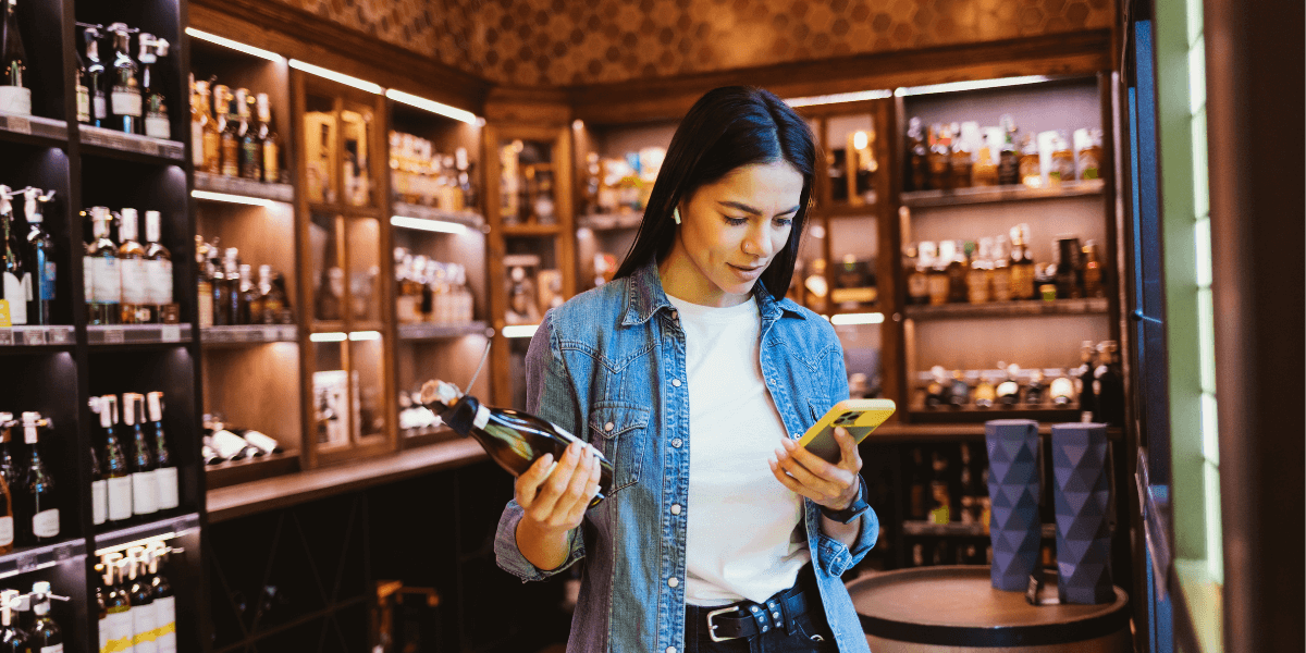 woman choosing liquor in a store