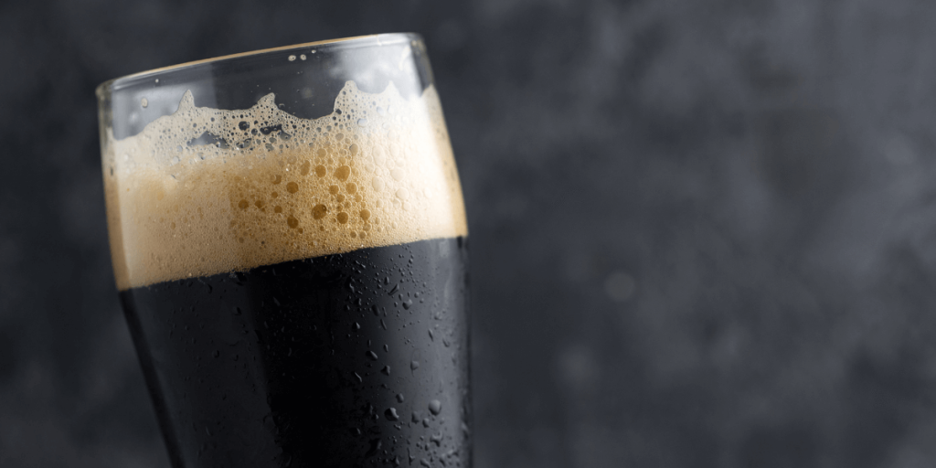 A close up of a porter in a glass